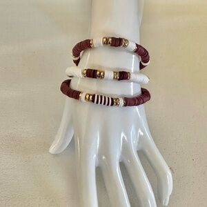 Dark Brown and White Clay Beaded Stretch Bracelets with gold accents.